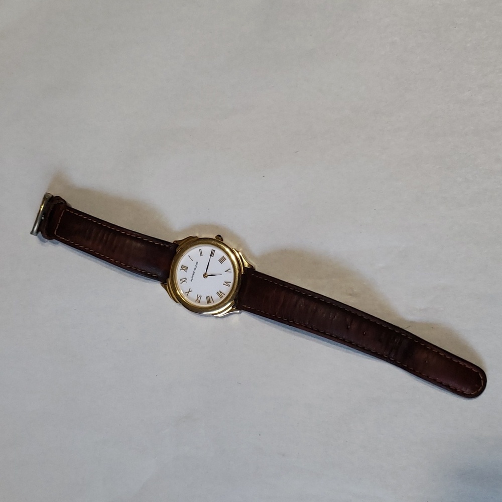 Alfred Sung Women's Watch. Goldtone with Brown Band.